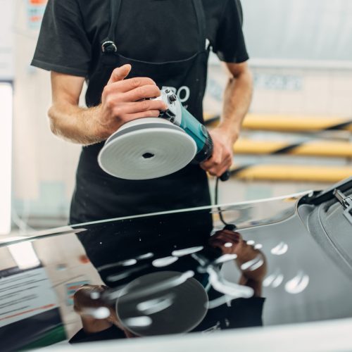 Male person prepares to restore the paint of car